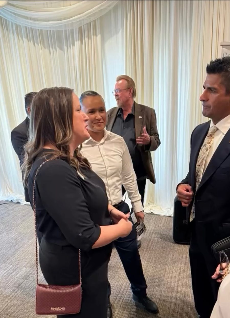 Dr. Johnny Alvarado talking with educators after a session
